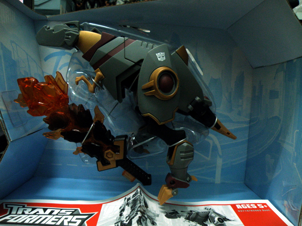Grimlock comes with an oversized sword and a transformation manual