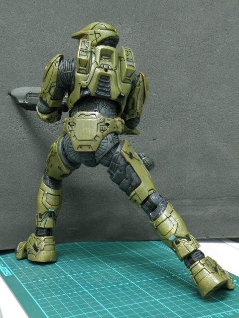 MasterChief taking aim with assault rifle back view.